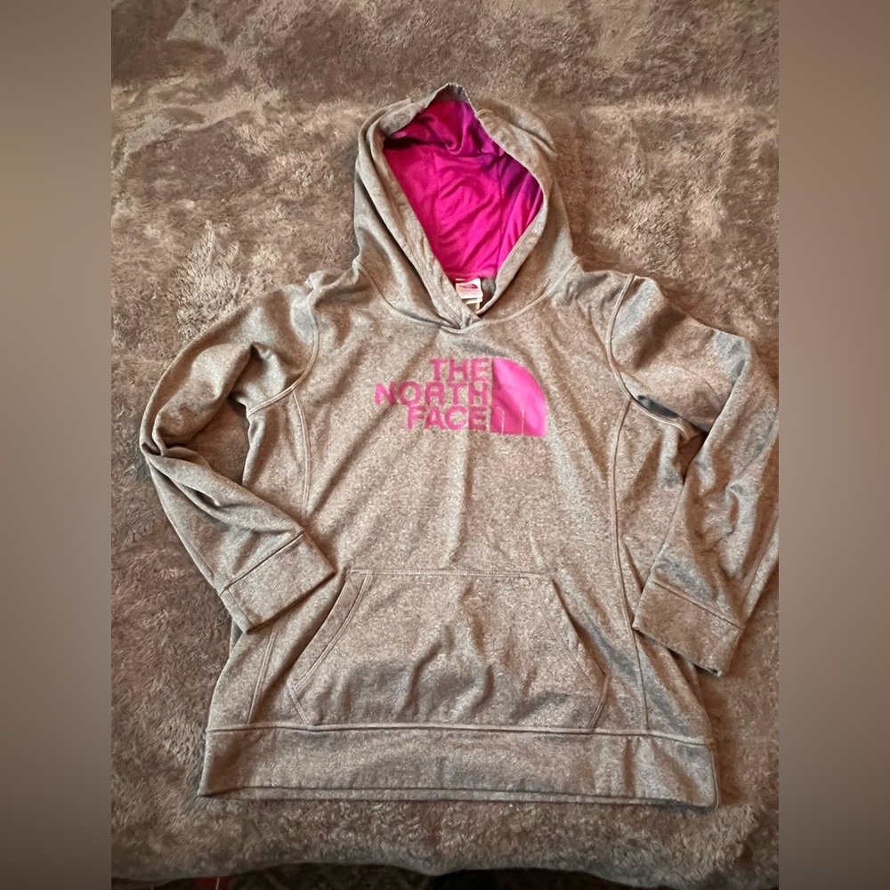 The North Face Grey and Barbie pink Dri Fit hoodie.